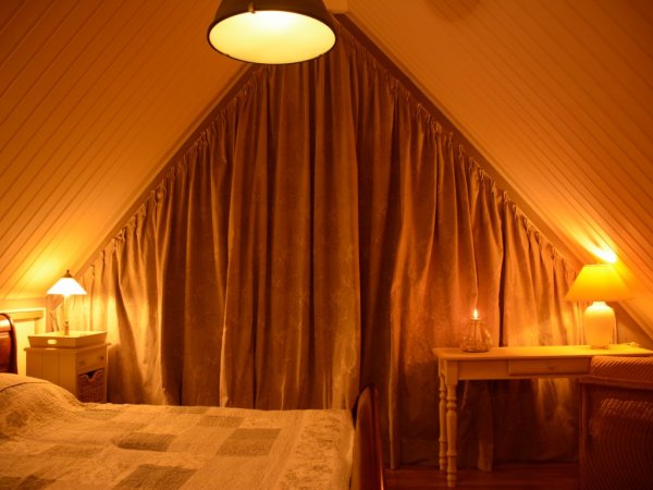 Bedroom upstairs with a small balcony..